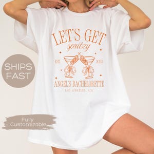 Let&#39;s Get Spritzy Bachelorette Shirt, Aperol Spritz Shirt, Aperol Club Shirt, Custom Girls Club Shirt, Spritz Cocktail Shirt, Party Matches