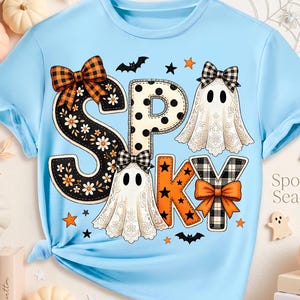 May include: A light blue t-shirt featuring the text SPOOKY in large decorative letters. The letters are adorned with floral patterns, polka dots, plaid bows, and two ghost illustrations. Small bats, stars, and the text Spooky Season are included.