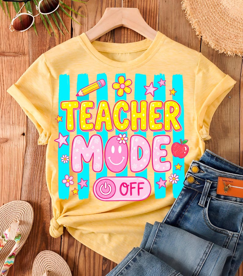May include: Yellow t-shirt with the text "TEACHER MODE OFF" in a colorful design. The shirt features a pencil, flowers, stars, and an apple graphic. Blue jeans and accessories are visible.