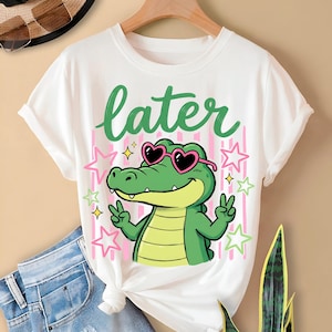 Later Gator PNG design with cute green alligator wearing heart sunglasses shirt