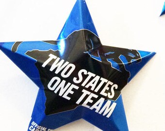 May include: A blue star-shaped paperweight with the text "TWO STATES ONE TEAM" and the outlines of two states in black. The paperweight also has the text "OFFICIAL SPONSOR CAROL"