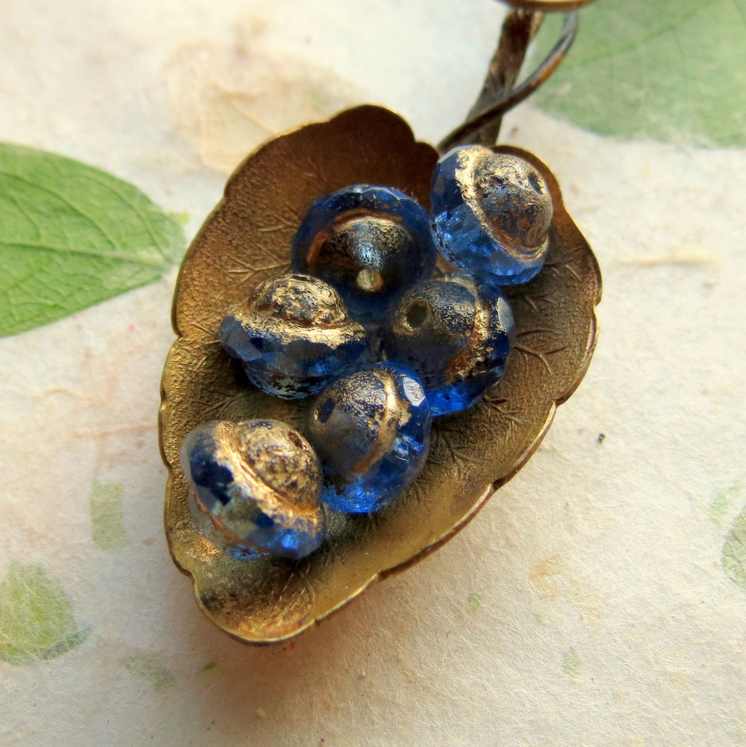 Boucles d'orelles perles en verre et en céramque vertes ans
