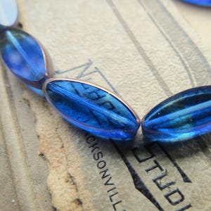 New BRONZED SAPPHIRE PETALS . 6 Czech Table Cut Swirled Spindle Beads . 18 mm by 7 mm beads .  Supplies for Jewelry Making