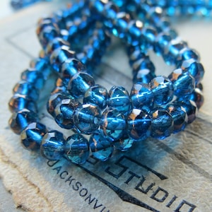 Czech Glass Rondelle Beads: Bronzed Capri Blue Metallic Faceted (3mm x 5mm)