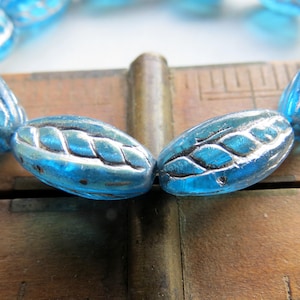 Czech Glass Oval Beads: Metallic Blue Twisted AB Finish (10 pc)