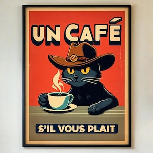 May include: A framed poster with a black cat wearing a cowboy hat, holding a coffee cup. The poster has the words "UN CAFÉ" and "S'IL VOUS PLAIT" on a red background. The cat has yellow eyes and steam is rising from the coffee.