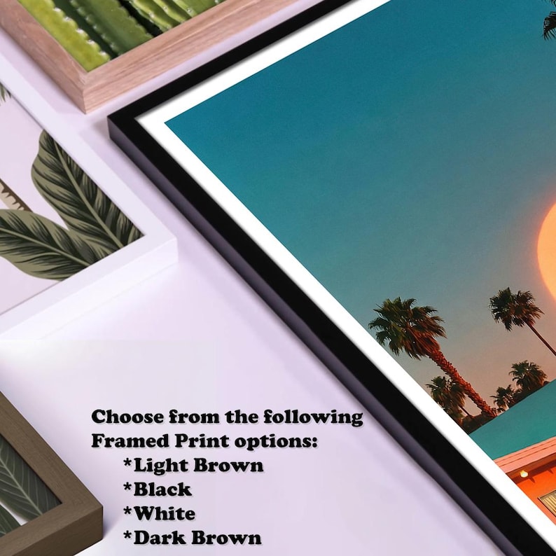 May include: Framed art prints with a tropical sunset scene, framed in black, white, light brown, and dark brown. The image features palm trees, a setting sun, and a building. Text on the image reads: Choose from the following Framed Print options: *Light Brown *Black *White *Dark Brown.