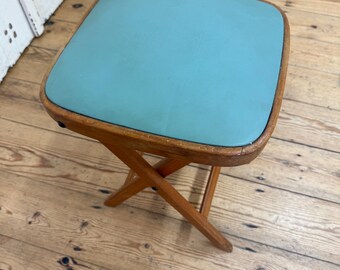 Vintage folding stool with upholstered seat