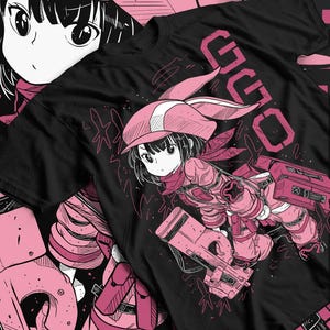 May include: Black t-shirt featuring a pink anime-style illustration of a character with a hat and holding a weapon. The word "OLD" is printed in pink on the top right. The design has a manga aesthetic.
