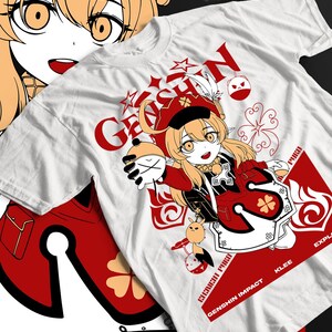 May include: White t-shirt featuring a vibrant anime-style illustration. The design includes a character in a red and black outfit, with the text "GENSHIN IMPACT" and "KLEE". The artwork is complemented by red graphic elements and stars.