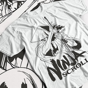 May include: White t-shirt featuring a black and white illustration of a samurai warrior with a sword, wearing a traditional hat. The text "NINJA SCROLL" is printed in large, bold letters below the illustration.