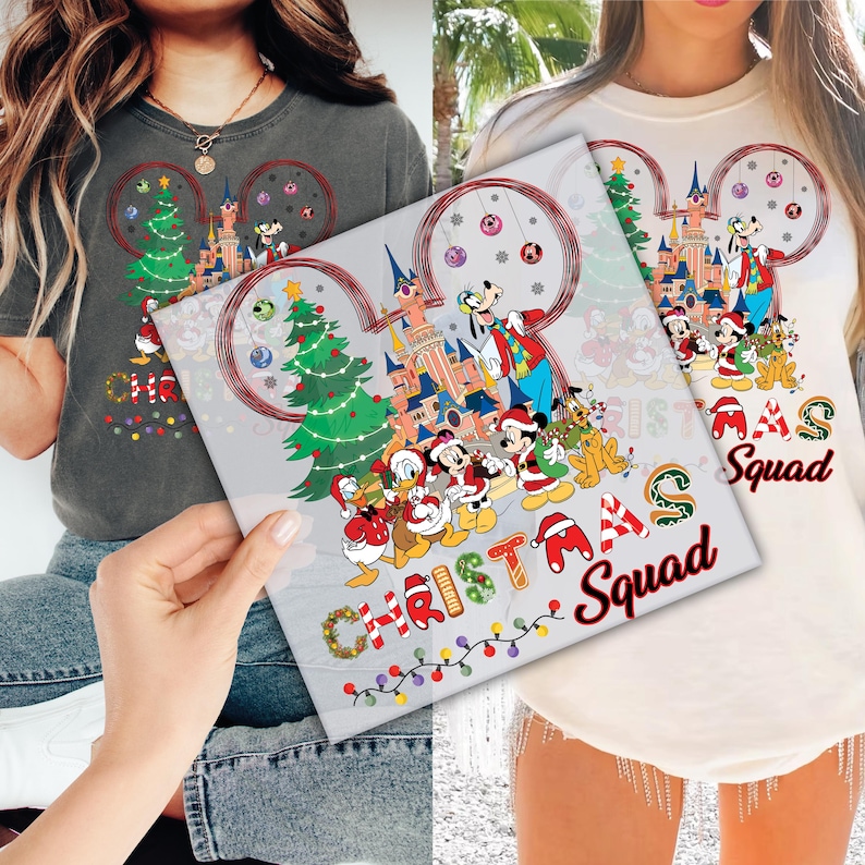 a couple of women holding up a picture of mickey mouse