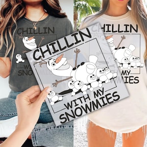 May include: Two women wearing white and gray t-shirts with a graphic of Olaf from Frozen. The text on the shirts reads "Chillin' with my snowmies".