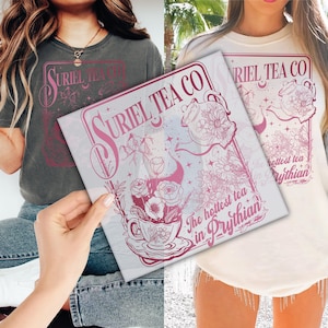 May include: A pink and white graphic design on a white t-shirt with the text "Uriel Tea Co. The hottest tea in Prythian".