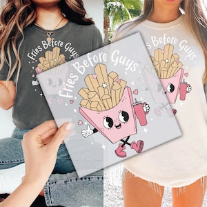 May include: Two gray and white t-shirts with a cartoon image of a pink french fry container with a face and the text "Fries Before Guys".