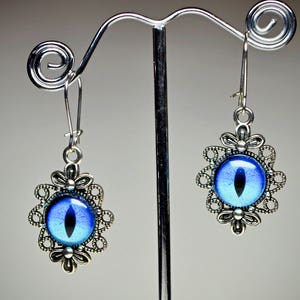 Dragon eye antique style silver tone flower earrings. Halloween earrings. Burning Man costume. Dangle earrings. Evil eye earrings.