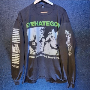 May include: Black long-sleeve t-shirt with a green and white graphic print of the band EyeHateGod. The graphic includes the band's name and the text "come inside and have fun". The left sleeve has a vertical graphic print of the band's name and the text "In the name of suffering".