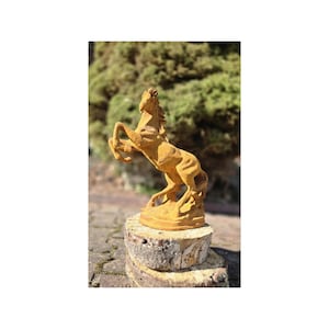Antique cast iron sculpture of a horse &quot;Mustang&quot;. Rustic figurine garden and home decoration. Beautiful and stylish cast iron sculpture