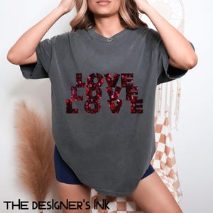 May include: A dark gray oversized t-shirt with a red sequined graphic that reads "LOVE LOVE LOVE".