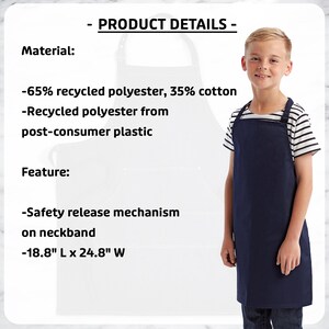 May include: A navy blue apron with a safety release neckband, worn by a young person. The apron is made of 65% recycled polyester and 35% cotton. The apron measures 18.8" L x 24.8" W. The product details are displayed in the image.