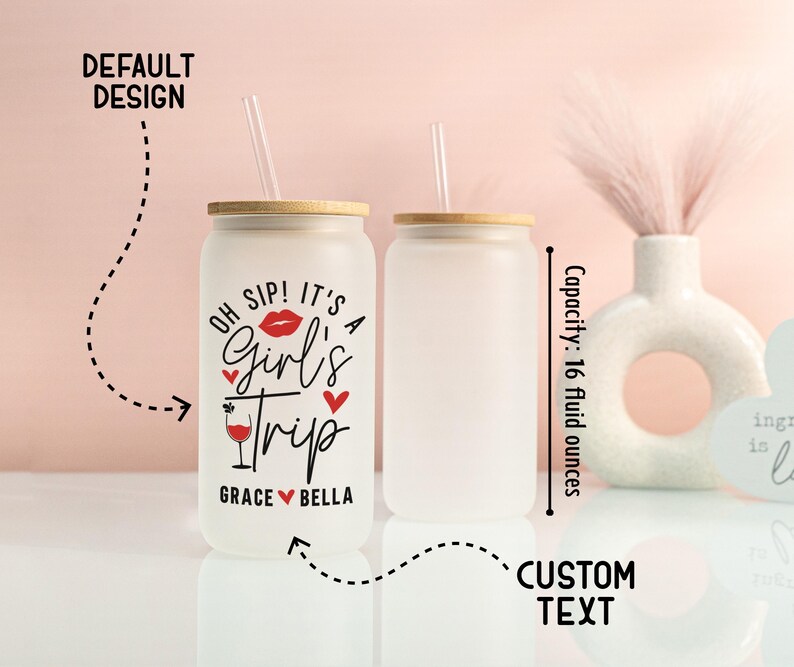 May include: Two frosted glass tumblers with bamboo lids and straws. One tumbler has the text "OH SIP! IT'S A Girl's Trip" with a red lip graphic and hearts. The capacity is 473 ml.