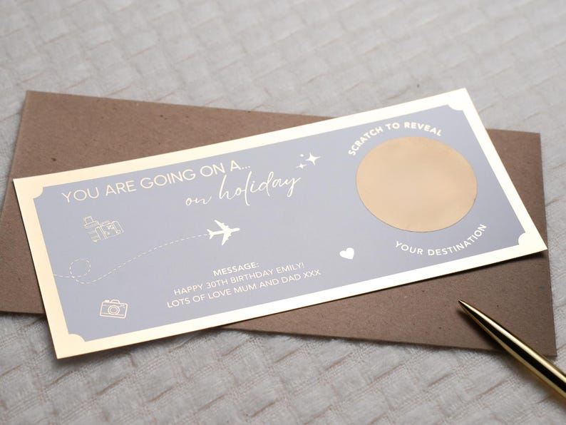 May include: A gold and gray scratch-off card with the text "You are going on a... on holiday."  The card has a gold circle with a scratch-off area that says "Your Destination."  The message on the card reads "Happy 30th Birthday Emily! Lots of love Mum and Dad xxx."