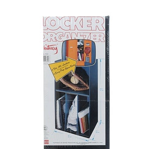 May include: A black locker organizer with a blue and orange locker in the background. The organizer has shelves and compartments for storing books, shoes, and other items. The text on the packaging reads "Locker Organizer" and "Fits All Lockers with a 12" x 12" Door Size. Easy Pop-Open Body."
