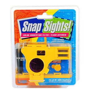 May include: A yellow plastic Snap Sights! color correction filter and flash diffuser for disposable cameras. The packaging features a blue and green background with water droplets.