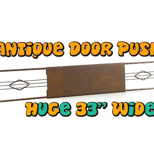 May include: Antique door push plate made of metal with a brown finish. The plate is 33 inches wide and has a diamond-shaped design.