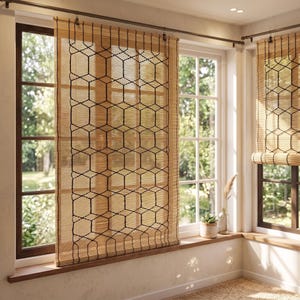 May include: A light brown bamboo roller shade featuring a black hexagonal geometric pattern overlay. The shade hangs from a dark metal rod mounted above a window, providing a natural texture and filtered light through the woven bamboo slats.