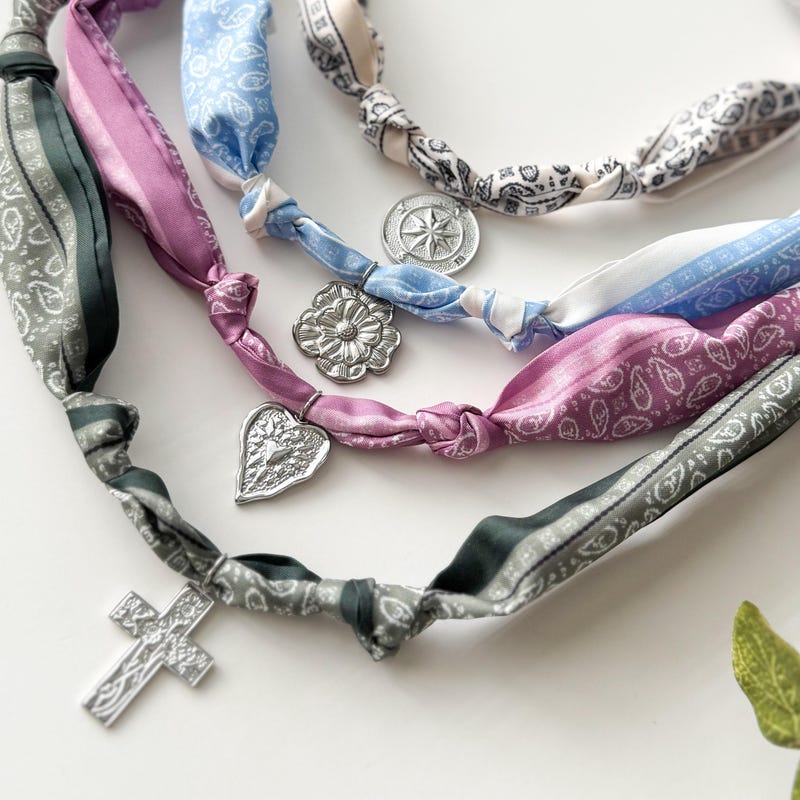 Scarf necklace with charms