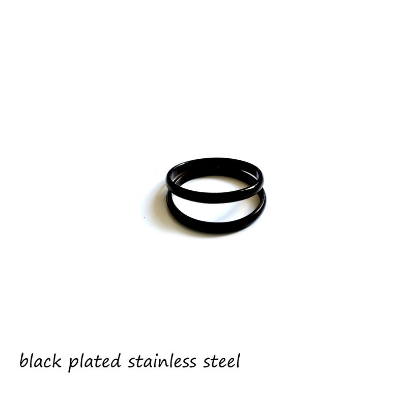 May include: Two black plated stainless steel rings stacked on top of each other.
