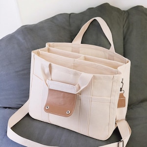 Stijlvolle en veelzijdige zwart-witte canvas draagtas moeder- en babyschoudertas dames schoudertas draagbaar, cadeau voor vrouwen