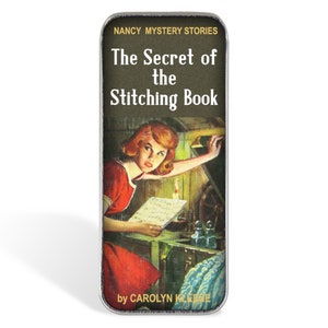 May include: A vintage book cover featuring a young girl in a red dress looking into a dark room with a lit candle. The title is "The Secret of the Stitching Book" by Carolyn Keene. This is a Nancy Drew Mystery Story.