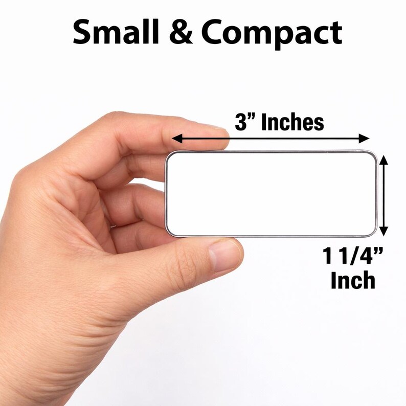 May include: A rectangular metal name badge with a white surface and silver border. The text Small & Compact appears above the object. Arrows indicate dimensions of 3 inches in length and 1 1/4 inches in height for this small, flat, blank item.