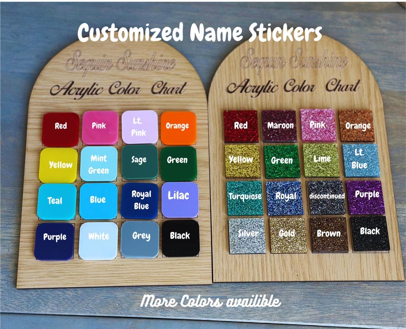 May include: Wooden display boards showcasing acrylic color swatches for custom name stickers. The boards feature a variety of colors, including red, pink, orange, yellow, green, blue, and purple, with glitter and solid finishes. Text reads "Customized Name Stickers" and "Acrylic Color Chart."
