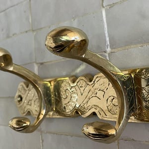 Brass Wall Hook,
Vintage Coat Hook,
Antique Brass Hanger,
Wall Mounted Hooks,
Rustic Home Décor,
Brass Entryway Hook,
Hat and Coat Hook,
Victorian Style Hook,
Towel Hook Bathroom,
Brass Hook,
Handcrafted Hook,
Decorative Wall Hook,