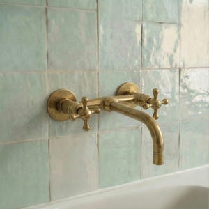 May include: A set of three ceramic mugs with a speckled, matte finish in cream, light grey, and dark grey. Each mug has a simple, minimalist design and a rounded handle.