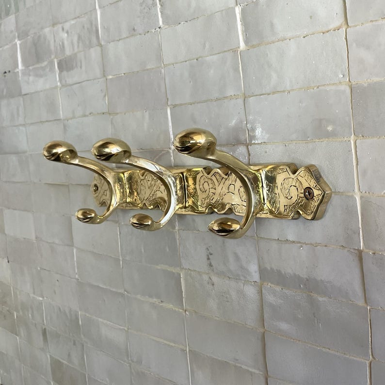 Brass Wall Hook,
Vintage Coat Hook,
Antique Brass Hanger,
Wall Mounted Hooks,
Rustic Home Décor,
Brass Entryway Hook,
Hat and Coat Hook,
Victorian Style Hook,
Towel Hook Bathroom,
Brass Hook,
Handcrafted Hook,
Decorative Wall Hook,