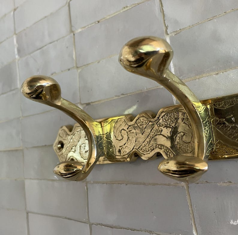 Brass Wall Hook,
Vintage Coat Hook,
Antique Brass Hanger,
Wall Mounted Hooks,
Rustic Home Décor,
Brass Entryway Hook,
Hat and Coat Hook,
Victorian Style Hook,
Towel Hook Bathroom,
Brass Hook,
Handcrafted Hook,
Decorative Wall Hook,