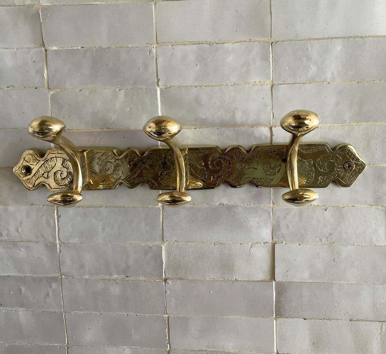 Brass Wall Hook,
Vintage Coat Hook,
Antique Brass Hanger,
Wall Mounted Hooks,
Rustic Home Décor,
Brass Entryway Hook,
Hat and Coat Hook,
Victorian Style Hook,
Towel Hook Bathroom,
Brass Hook,
Handcrafted Hook,
Decorative Wall Hook,