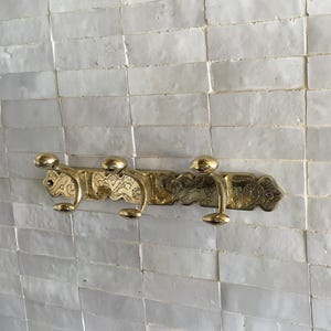 Brass Wall Hook,
Vintage Coat Hook,
Antique Brass Hanger,
Wall Mounted Hooks,
Rustic Home Décor,
Brass Entryway Hook,
Hat and Coat Hook,
Victorian Style Hook,
Towel Hook Bathroom,
Brass Hook,
Handcrafted Hook,
Decorative Wall Hook,