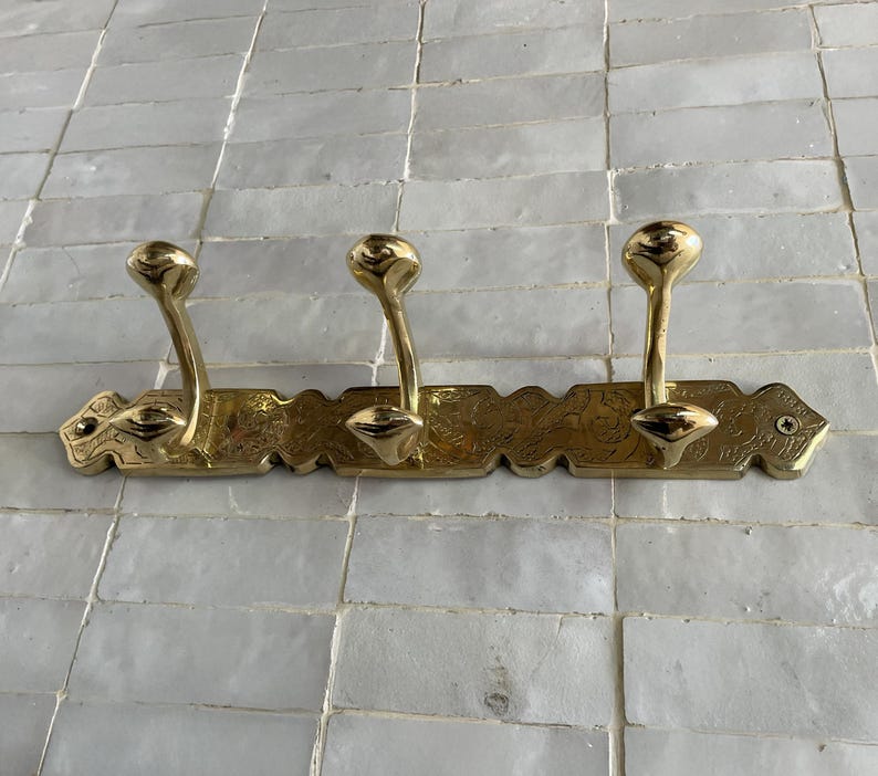 Brass Wall Hook,
Vintage Coat Hook,
Antique Brass Hanger,
Wall Mounted Hooks,
Rustic Home Décor,
Brass Entryway Hook,
Hat and Coat Hook,
Victorian Style Hook,
Towel Hook Bathroom,
Brass Hook,
Handcrafted Hook,
Decorative Wall Hook,