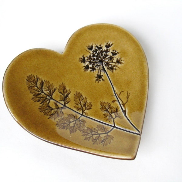 RESERVED for GUNDEGA, Heart dish with Queen Ann's Lace impression in amber /  brownish yellow