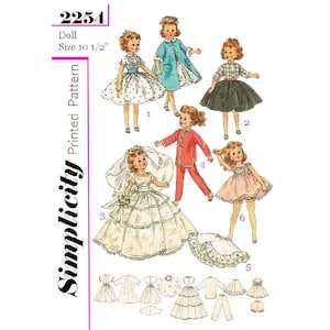 May include: A vintage Simplicity printed pattern, number 2254, showcasing doll clothing designs. The image displays six dolls in different outfits, including a wedding dress, a coat, and a skirt. The doll size is 26.67 cm.