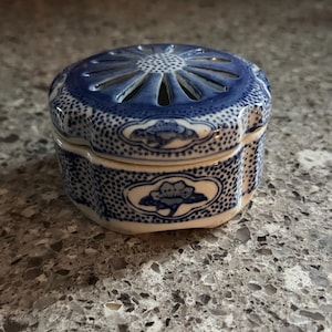 May include: A rustic wooden sign with the text "Welcome to our home" in white lettering. The sign features a distressed finish and a simple, inviting design, perfect for a front porch or entryway.