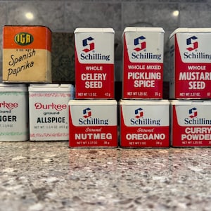 May include: A set of three ceramic mugs with a speckled, matte finish. The mugs are in shades of cream, light gray, and dark gray. Each mug has a simple, minimalist design, perfect for coffee or tea.