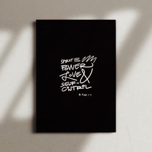 May include: Black and white typography print with the text "Spirit of the Power Love & Self-Control" and the scripture reference "2 Tim 1:7".