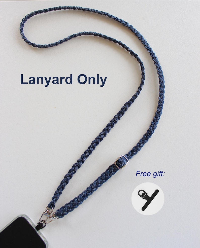 May include: A dark blue braided cord lanyard featuring a silver-toned metal adjustable slider and two lobster claw clasps attached to a phone case. The text Lanyard Only and Free gift are printed on the image next to a small icon.
