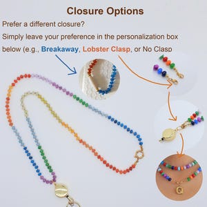 Puede incluir: Un cord&oacute;n de cuentas con los colores del arco&iacute;ris, con un cierre y conector de metal dorado. La imagen muestra el texto Closure Options, Prefer a different closure? Simply leave your preference in the personalization box below (e.g., Breakaway, Lobster Clasp, or No Clasp).